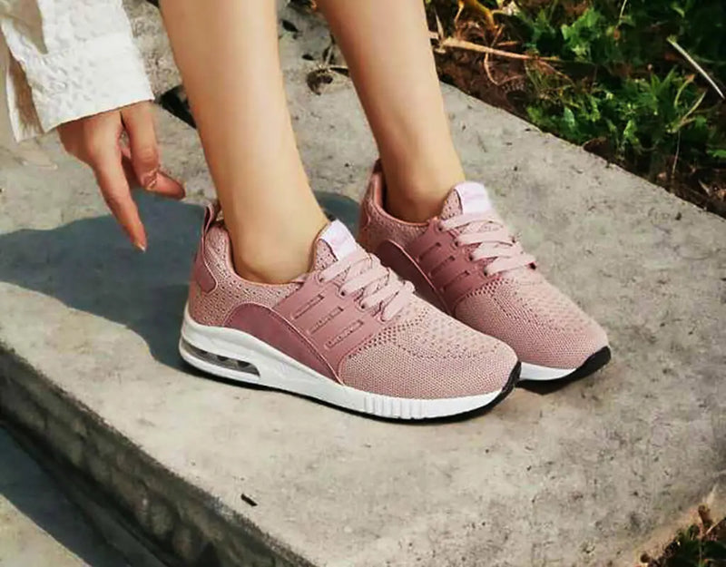Löparskor lifestyle image Rosa och elastisk förslutning